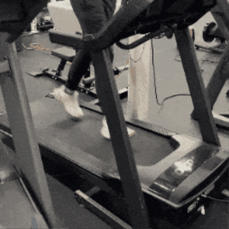 A person running on the  Horizon 7.0 AT treadmill. 