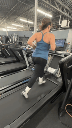 A person running on the NordicTrack Commercial 1750 treadmill.