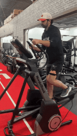 A person using the NordicTrack FS10i elliptical machine