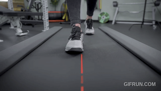 A person walking on the Peloton Cross Training Tread.