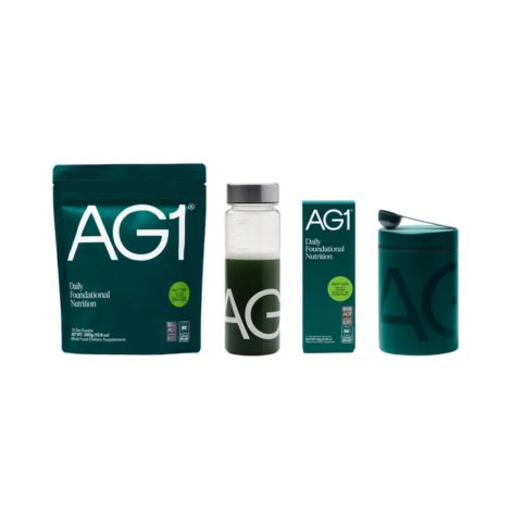 A bag of AG1, a bottle with AG1 mixed in liquid, and the AG1 canister