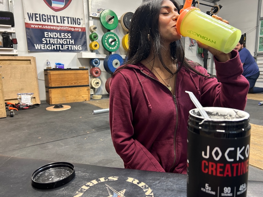 Product tester drinking shaker cup of Jocko Creatine