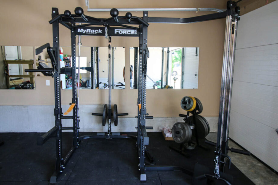 A black Force USA MyRack set up in a garage gym