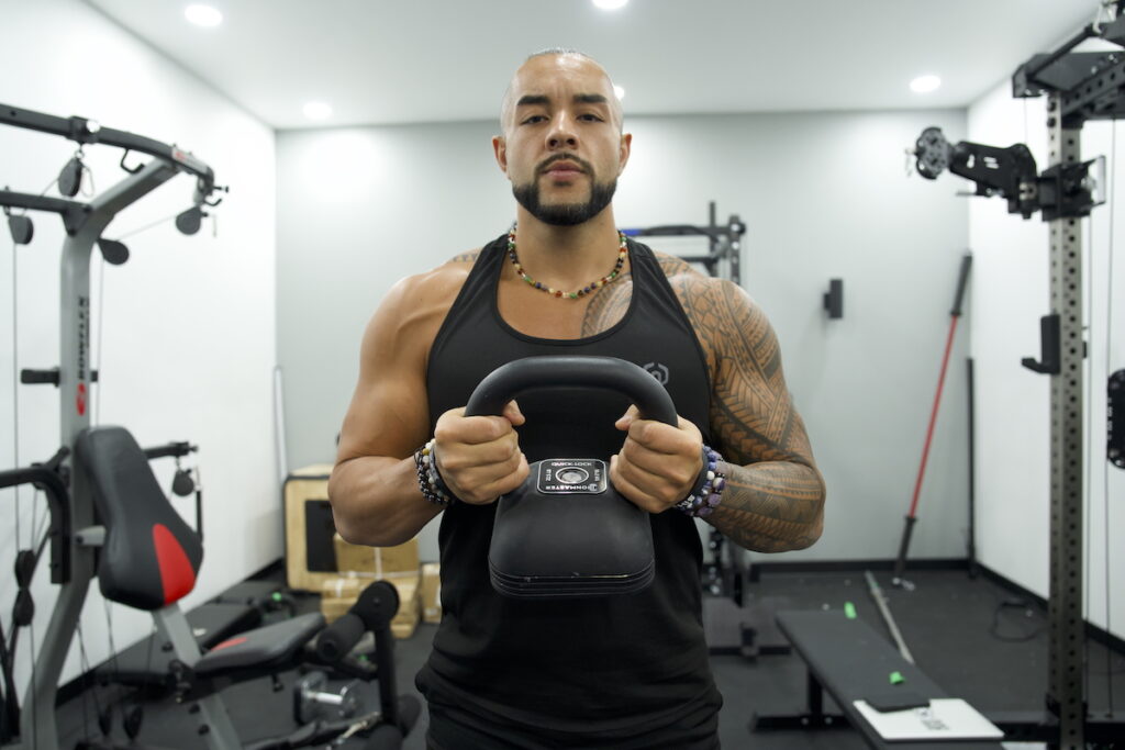 GGR writer Stephen Sheehan lifting an Ironmaster Quick-Lock adjustable kettlebell.