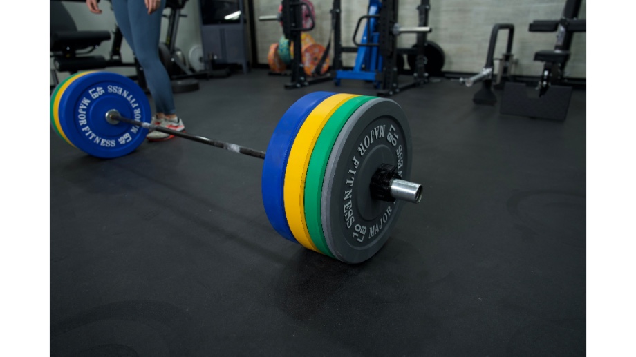 A barbell on rubber flooring with Major Fitness Bumper plates