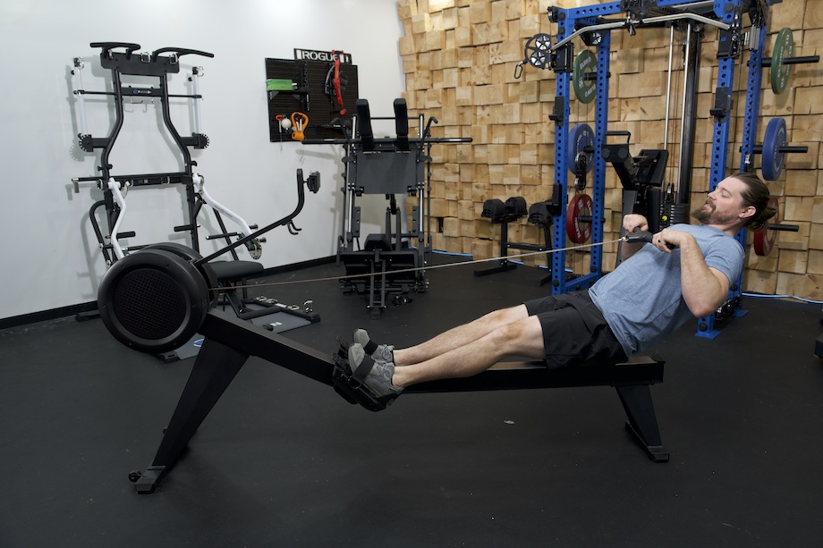 An image of a person rowing on the Yosuda Dragonfly rowing machine