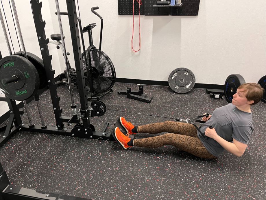 A person using the Major Fitness F22 All-In-One Home Gym.