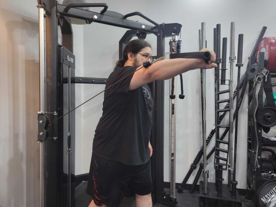 A man testing a functional trainer