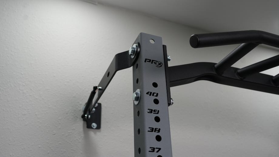 A closer look at the connection of the PRx Profile PRO Squat Rack mounted onto the wall
