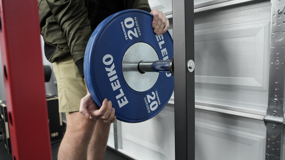 Loading weight plates onto the REP PR-1100.