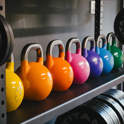 Titan Fitness Competition Style Kettlebells on a shelf