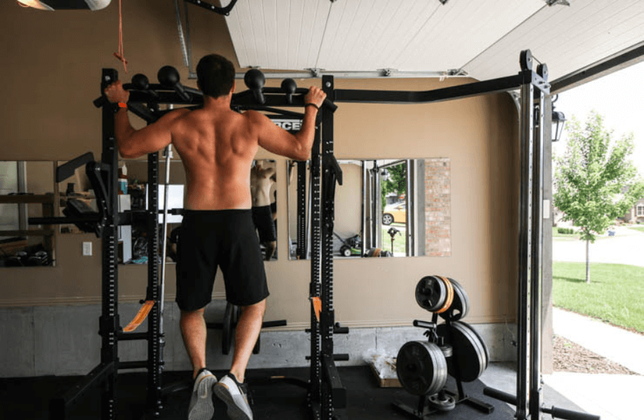 Our tester performing a pull-up on the Force USA Modular MyRack setup