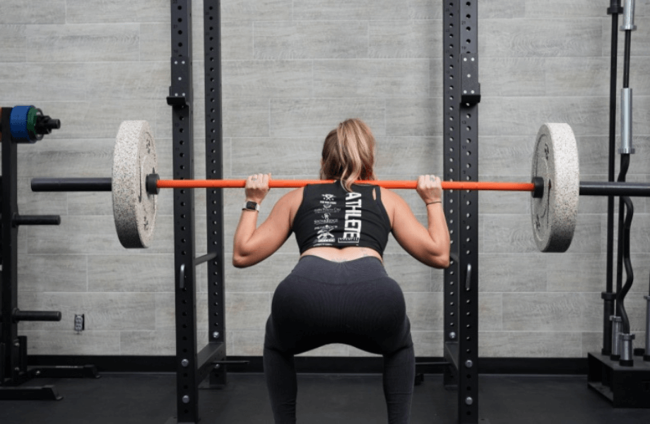 Our tester performing a back squat with Nike Grind Bumper Plates
